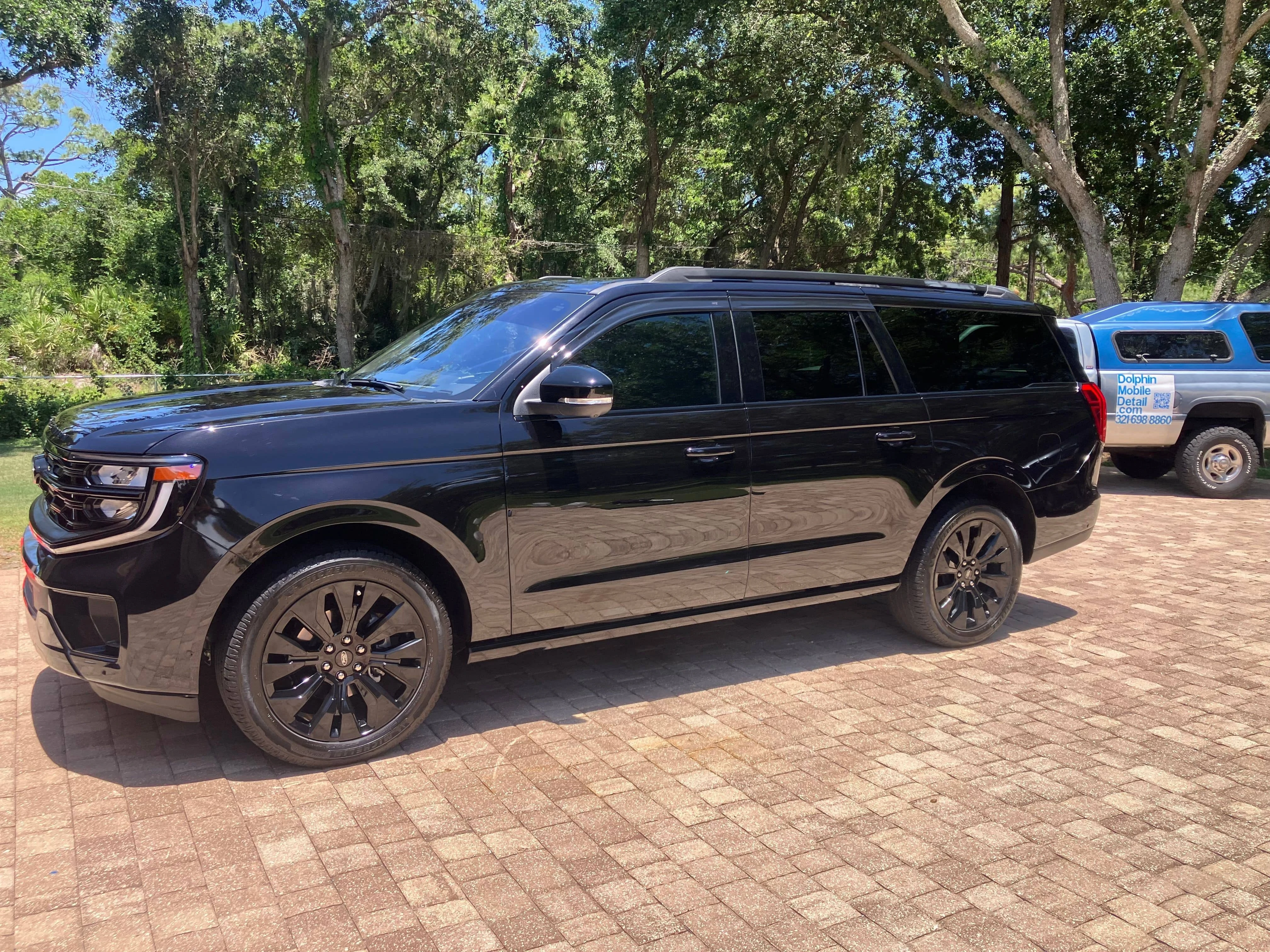 Premium mobile detailing and ceramic coating service in Melbourne FL High-gloss exterior paint protection and clear coat restoration completed on a luxury customer vehicle by Dolphin Mobile Detail in Melbourne Florida
